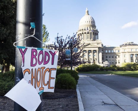 Protesters hold signs reading "Abortion Saves Lives" outside the supreme court