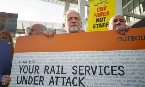 Labour party leader Jeremy Corbyn, centre, joins rail trade union representatives to protest against fare increases and to call for the railways to be re-nationalised