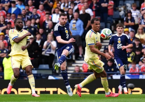 Scotland's Andrew Robertson thwacks a shot over the bar.