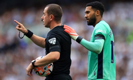 Wes Foderingham with a hand over Peter Bankes’s shoulder during Tottenham’s win over Sheffield United