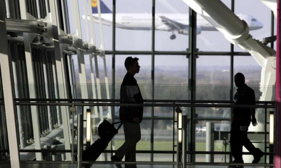 Passengers walk into Terminal 5 at Heathrow