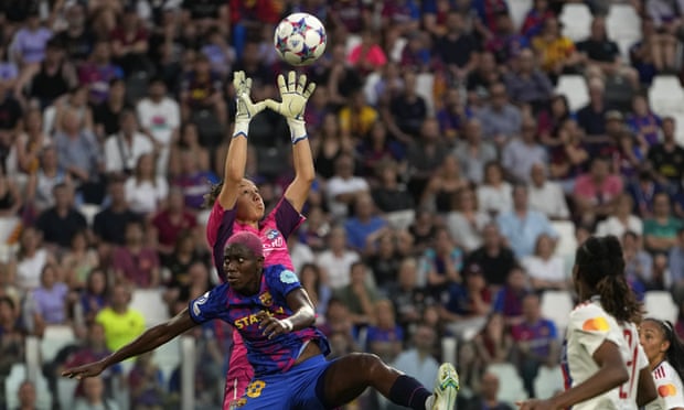 One of the best goalkeepers in the world, Lyon’s Christiane Endler, jumps to catch the ball against  Barcelona during the Champions League final.