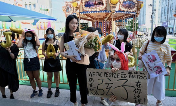 Zhou Xiaoxuan with supporters as she arrived at the hearing on Wednesday.