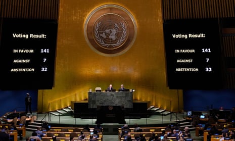 Screens at the UN headquarters read: 'Voting Result: in favour 141, against 7, abstention 32"