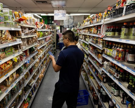 People in the aisle of a grocery store in Los Angeles
