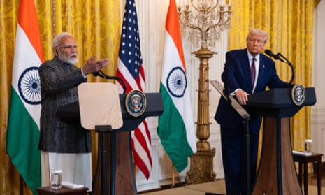 Trump and Modi stand behind lecterns during a press conference