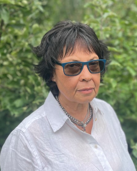 Joyce Thomas in sunglasses and a white shirt