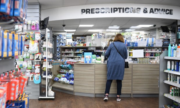 A customer inside a pharmacy in Streatham, south London.
