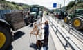 Dutch painter Cedric Visser paints as tractors block a highway