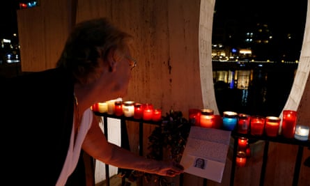 A woman reads a letter to investigative journalist Daphne Caruana Galizia during a silent candlelight vigil to protest against her murder, in St Julian’s, Malta.