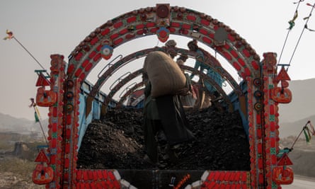 Sacks of coals being loaded on to a truck in Mach, Balochistan.