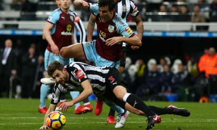 Burnley’s Jack Cork is sent sprawling by Paul Dummett of Newcastle United but no penalty was given.