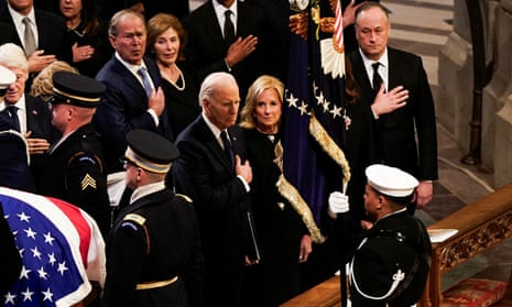 Joe Biden hails Jimmy Carter’s character in eulogy at memorial service celebrating former president’s long life – latest updates a group of people in pews