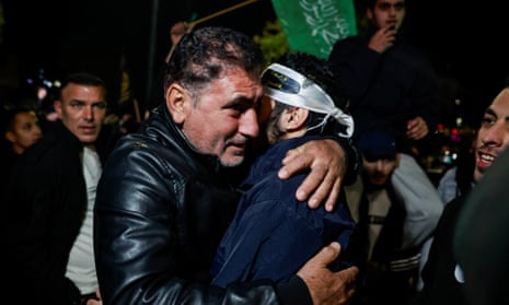 A freed Palestinian hugs his father