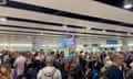 People wait in line at Heathrow airport, after the Border Force suffered a nationwide technical issue that affected passport control, in London, Britain.