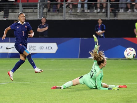 France's Sakina Karchaoui (left) shoots and scores France's third goal in their 5-0 friendly win over Belgium.
