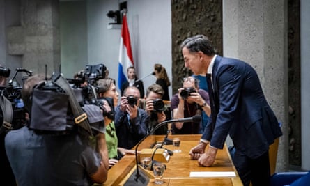 Mark Rutte speaks with a member of the ChristenUnie party, Mirjam Bikker, in parliament