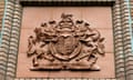 UK's coat of arms in brick coloured stonework