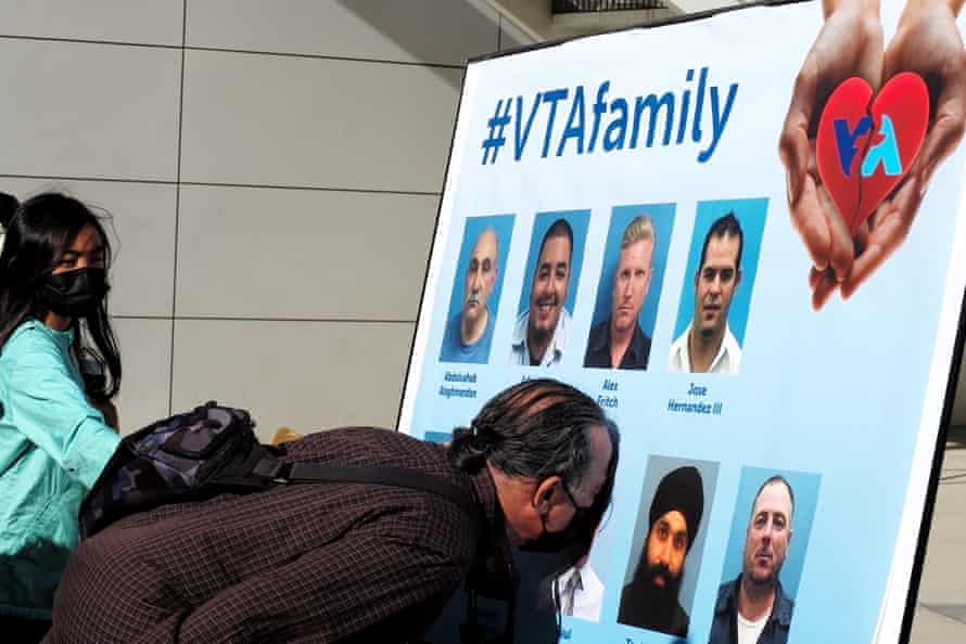 Relatives mourn for victims of a mass shooting in San Jose.