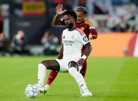 Vinícius Júnior and Wesley battle for the ball during the Champions League match between Roma and Real Madrid