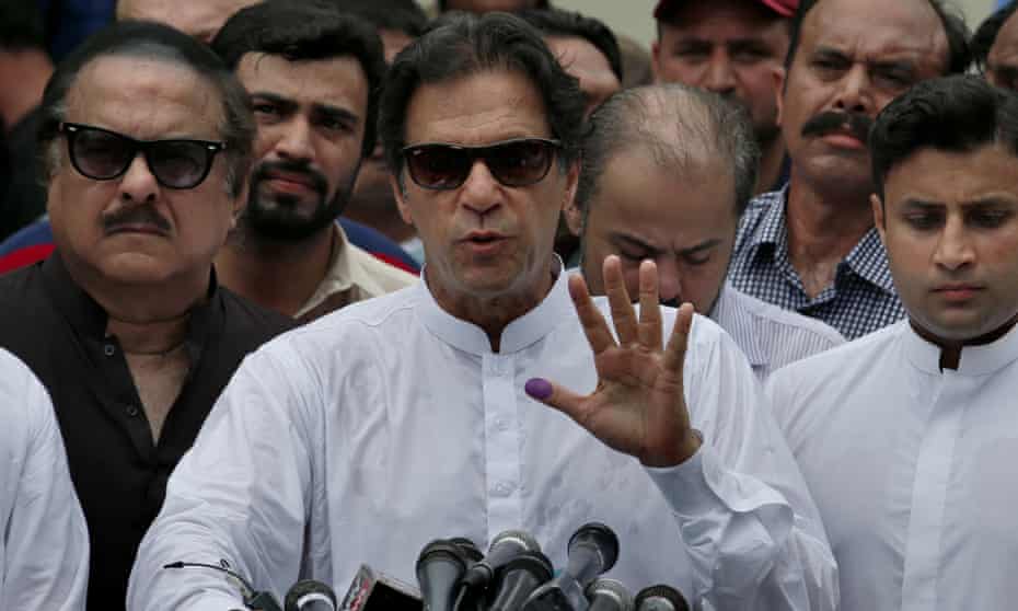 Imran Khan speaks to media after casting his vote at a polling station in Islamabad.