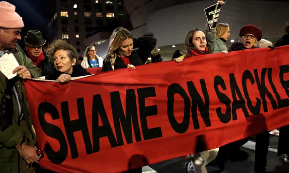 People protest against the Sackler family outside the Guggenheim museum in New York on 9 February. The museum has said it will not accept any donations from the family. 