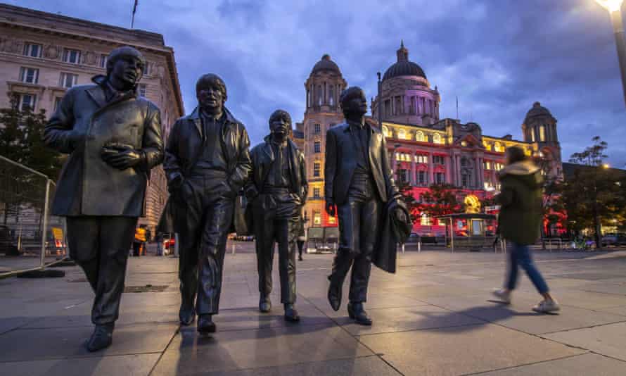 A statue of the Beatles on Pier Head