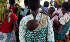 Mothers carrying children and waiting at a rural health clinic