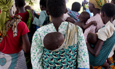 Mothers carrying children and waiting at rural health clinic