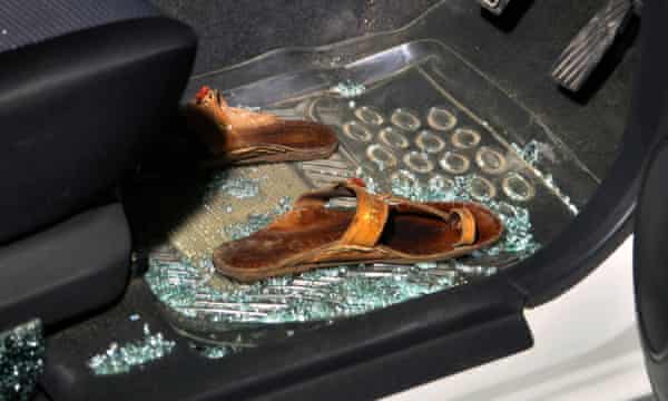 Sabeen Mahmud's sandals lie on the floor of the car after she was shot.