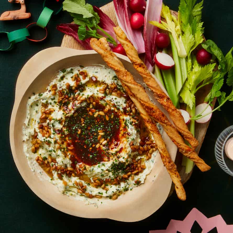 Yotam Ottolenghi's three-cheese dip with spicy date syrup and pine nuts.