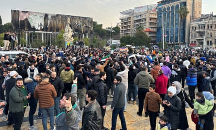People gather at Saadallah al-Jabiri Square in Aleppo