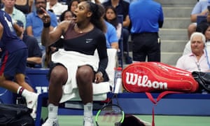 Serena Williams points at the umpire