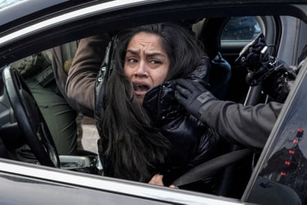 a woman is grabbed from her car