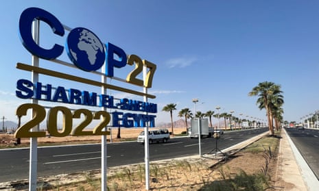 View of a Cop27 sign on the road leading to Egypt's Red Sea resort of Sharm el-Sheikh. US funding for fossil fuel projects threatens to undercut Joe Biden’s message of climate leadership.