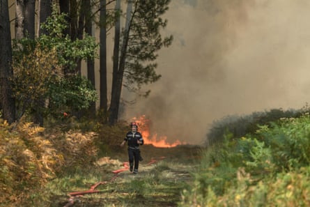 Firefighters tackle a wildfire near Lanton, west of Bordeaux