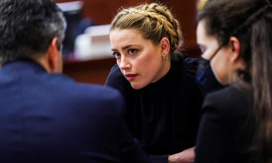 Actor Amber Heard sits with her legal team during Johnny Depp’s defamation case against her at the Fairfax County circuit court in Virginia on Thursday.
