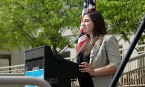 Katie Fahey speaks at rally in still from Slay the Dragon.