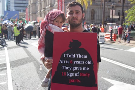 Jawad Al Maj, who came to Australia as a refugee from Iran, holding his two-year-old daughter Khadija.