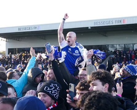 Macclesfield Town’s Josh Kay celebrates with fans after beating the Cup holders Crystal Palace