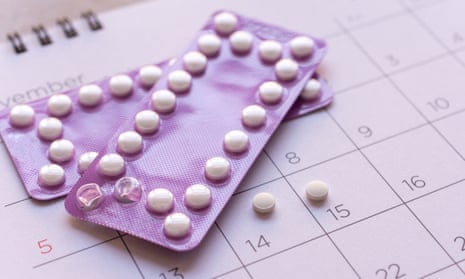 Packets of a contraceptive pill on a calendar