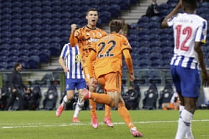 Juventus' Cristiano Ronaldo celebrates after teammate Federico Chiesa (center) pulls out a goal for the visitors.