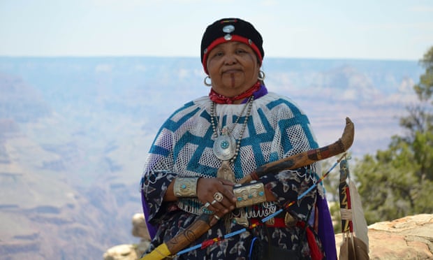 Dianna Sue White Dove Uqualla stands outside a lodge in Grand Canyon National Park.