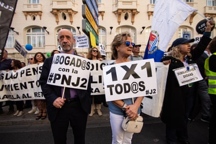 More than 30,000 lawyers, court clerks, architects and engineers demonstrated with placards calling for better state pensions