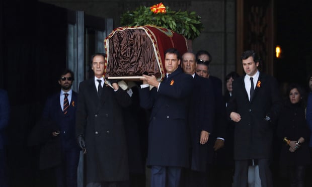 Relatives carry Franco’s coffin at the Valley of the Fallen