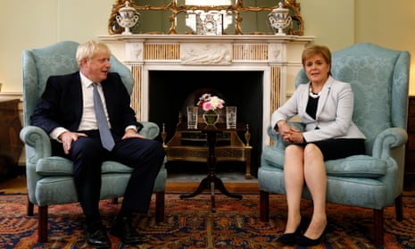 Boris Johnson poses for a photograph with Nicola Sturgeon at Bute House in Edinburgh.