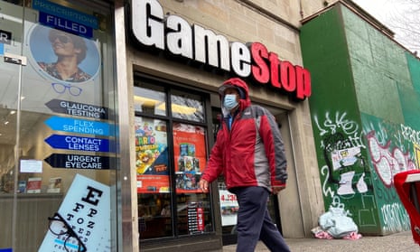 a man passes a gamestop store