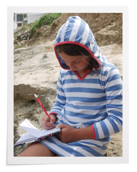 Mills writing one of her stories, on holiday in 2018