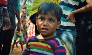 A Rohingya boy is brought to a lost-and-found booth in Kutupalong camp, Cox’s Bazar, Bangladesh.