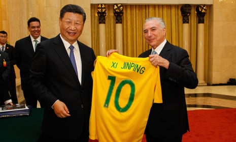 President Michel Temer of Brazil, right, presents China’s president, Xi Jinping, with a Brazilian football jersey signed by Pelé before the start of their bilateral meeting in September 2017 in Beijing.